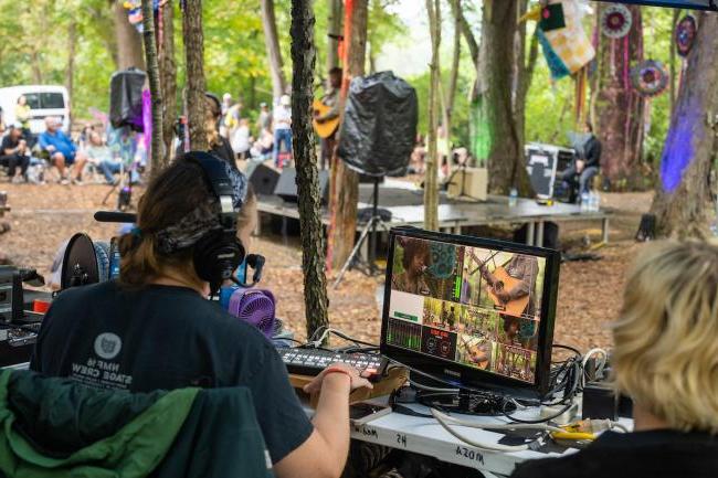 Students work on recording equipment backstage during the 2022 Nelsonville Music Festival