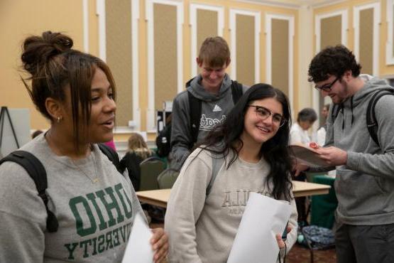 Two students gather information at the Majors Fair